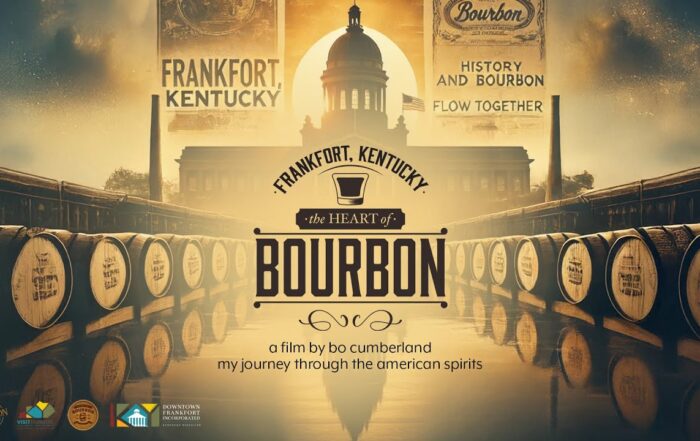 Barrels of bourbon lined up on either side of the Kentucky River with the Kentucky State Capitol dome in the background and film title "Frankfort, Kentucky: The Heart of Bourbon" overlayed in vintage style
